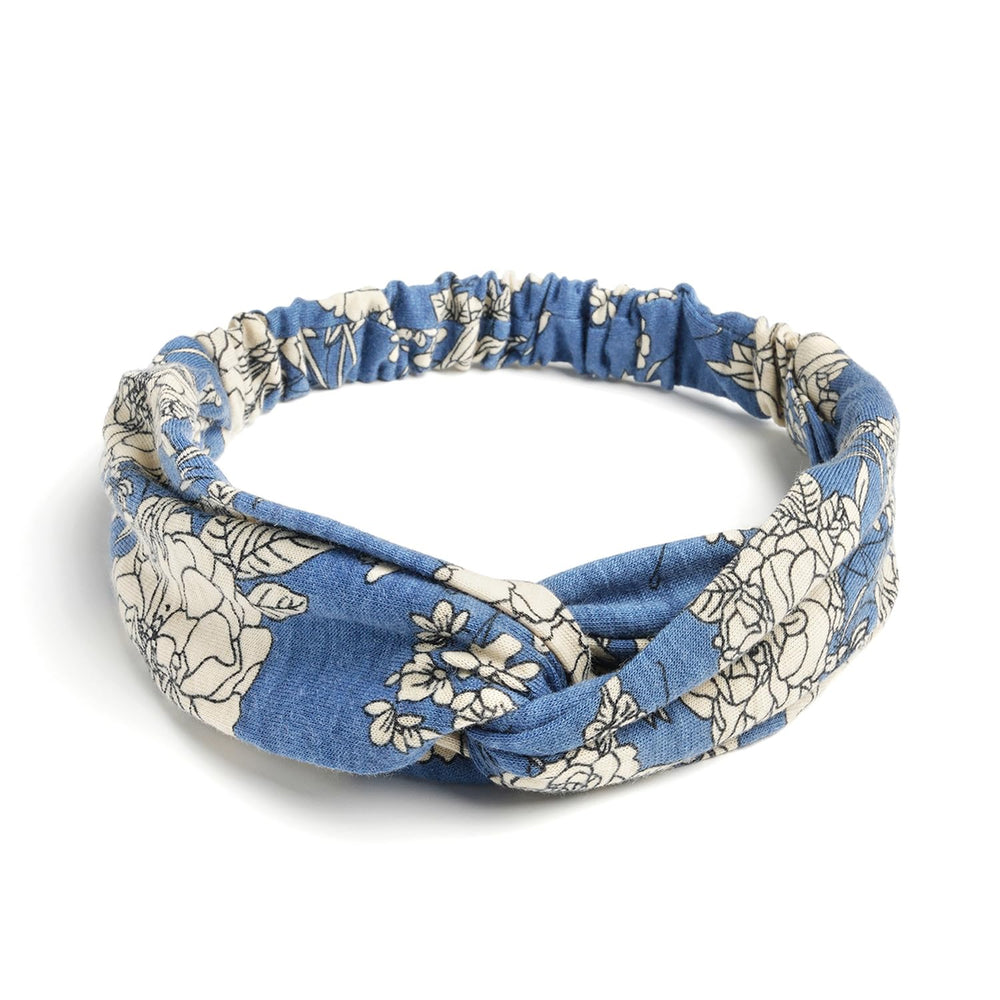 AQOKKA headband worn during yoga demonstrating sweat control and hold