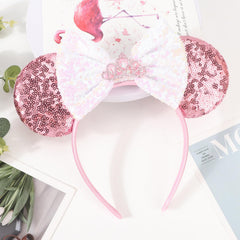 AQOKKA headband in hand showing size and flexible stretch for fit