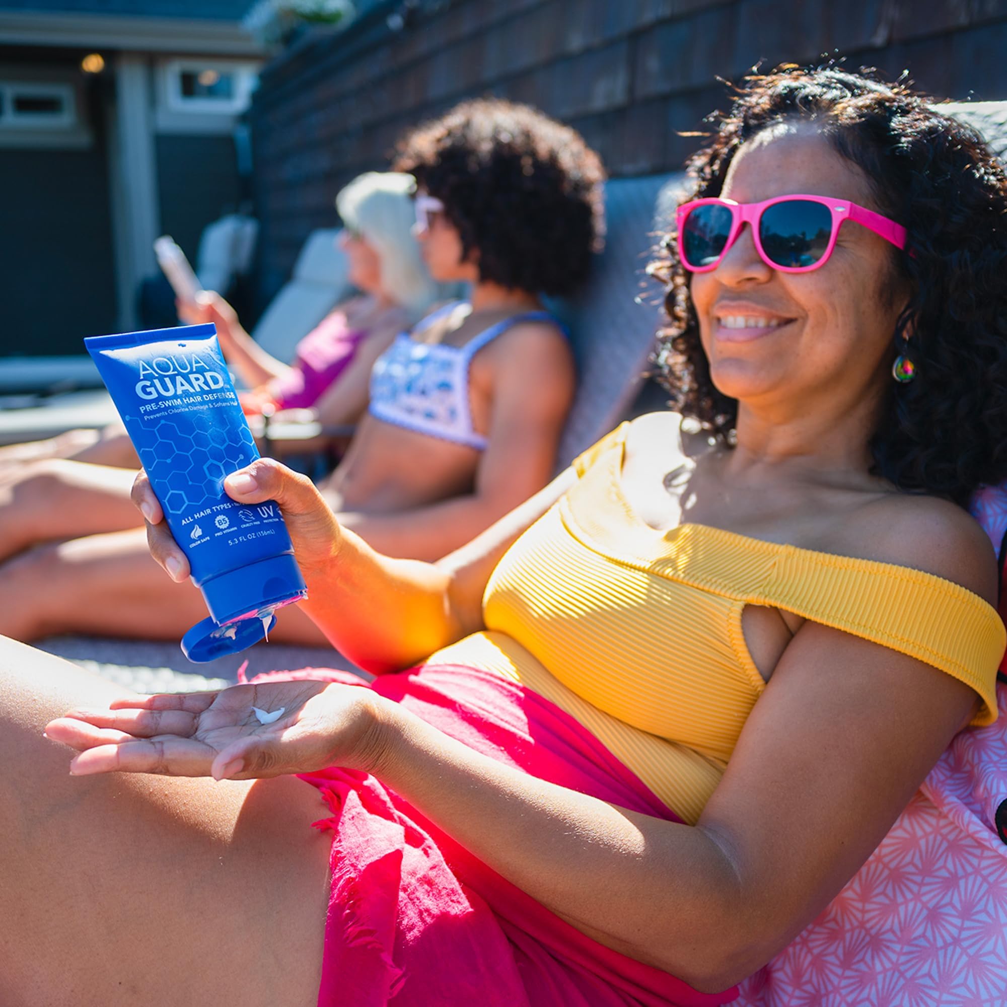 AQUA GUARD being applied to damp hair before swimming for protection