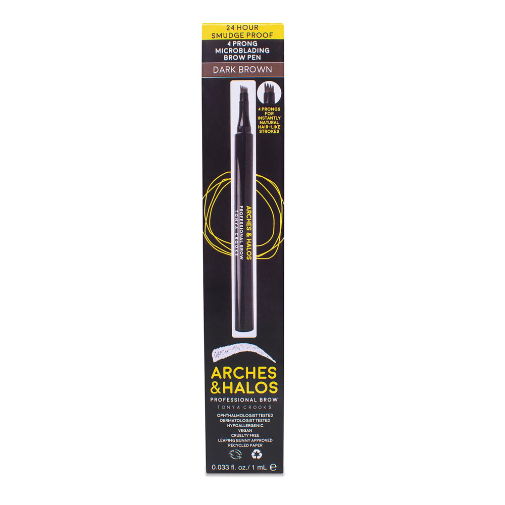 Arches & Halos pen beside coin showing travel-ready compact size
