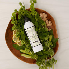 Archipelago Botanicals bottle beside fresh mint leaves suggesting natural botanical benefit