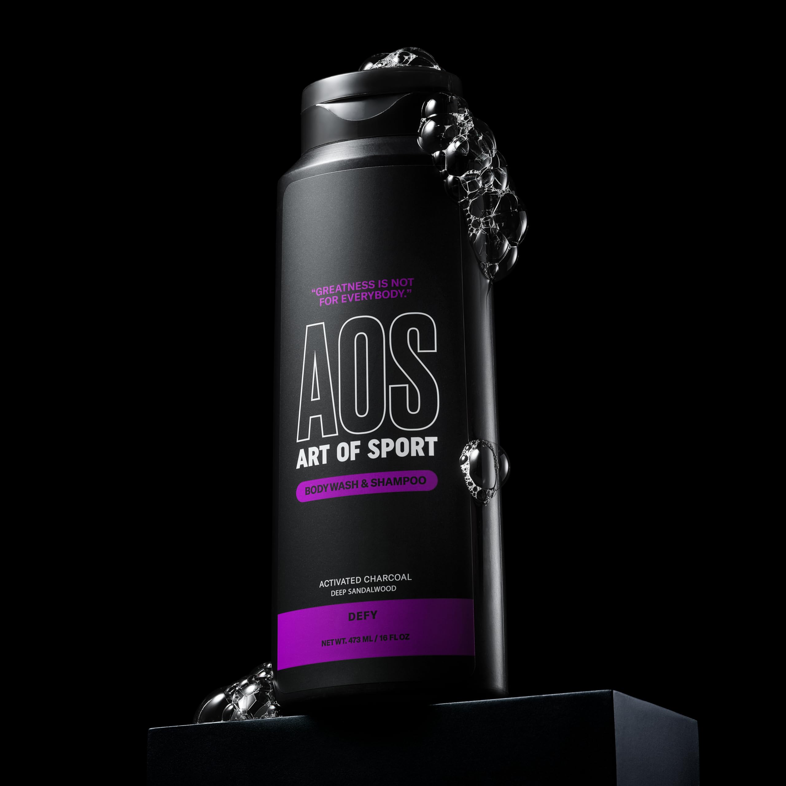 Art of Sport in-shower lifestyle shot showing athlete using two-in-one cleanser after workout