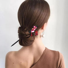 Arvintas floral tassel detail on stick demonstrating handcrafted charm and decorative flair