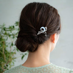 Arvintas hair sticks in a bun updo showing stable hold and stylish silhouette