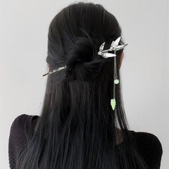 Arvintas hair sticks securing a bun demonstrating stable hold and elegant appearance