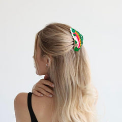 Arvintas salmon claw on vanity during skincare showing hands free convenience benefit