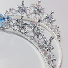 Arvintas tiara in winter-themed setting adding icy accent to bridal or party look