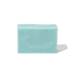 As I Am bar next to calendula flowers and hemp seeds highlighting natural ingredient benefit