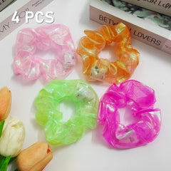 Asawira scrunchies displayed on a party table lighting a night event ambience
