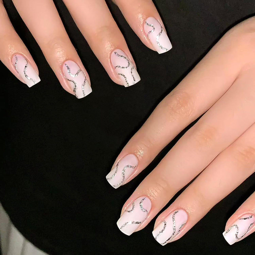 Ashowner prepping nails with wooden cuticle pusher, promotes better adhesion benefit