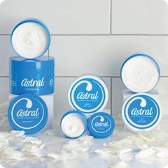 Astral cream applied to hand in lifestyle scene showing hydration benefit