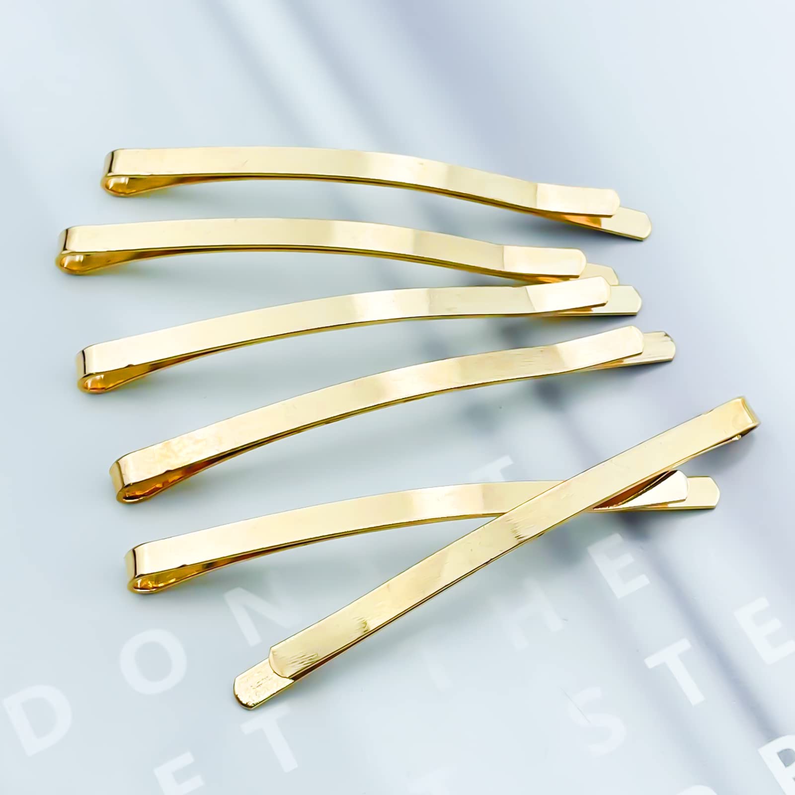 Aswewamt bobby pins beside ruler showing exact 65mm length advantage