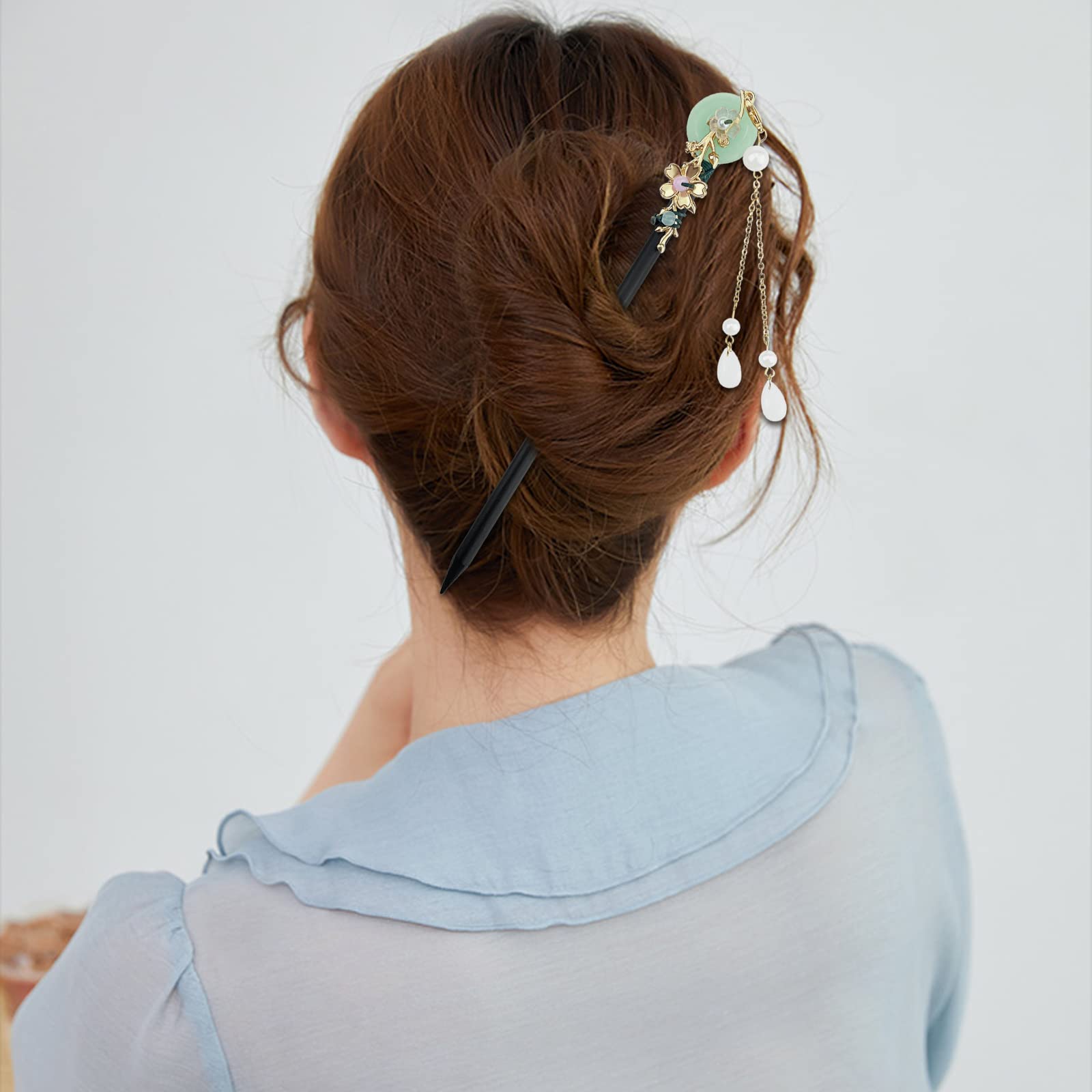 Aswewamt hair stick inserted in bun showing secure hold and comfort