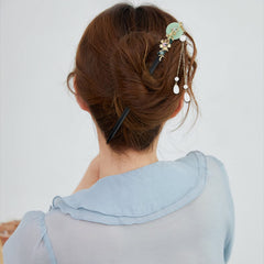 Aswewamt hair stick inserted in bun showing secure hold and comfort
