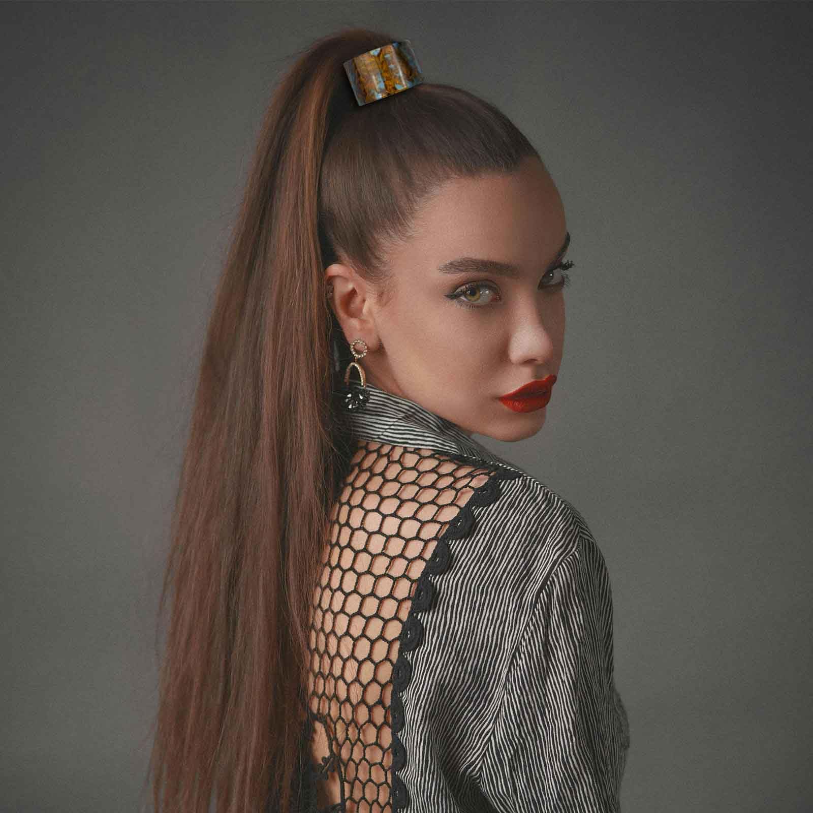 Aswewamt half-up hairstyle showcasing decorative cuff for instant polish