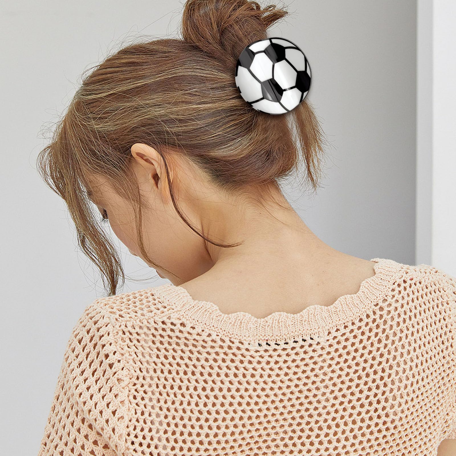 Aswewamt clip worn in half-up hairstyle offering tidy look and sport flair