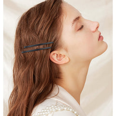 Aswewamt pins securing an elegant updo, keeps style in place