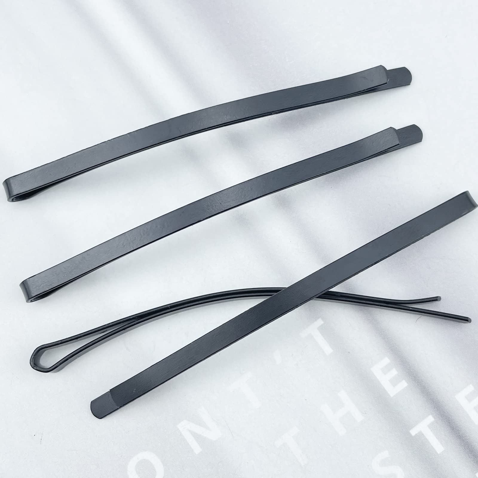 Aswewamt pins scattered on table, convenient large pack for stylists