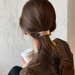 Aswewamt model wearing bun clip demonstrating neat, all-day hold