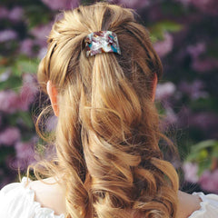Aswewamt worn high ponytail displaying refined look and damage-minimizing grip