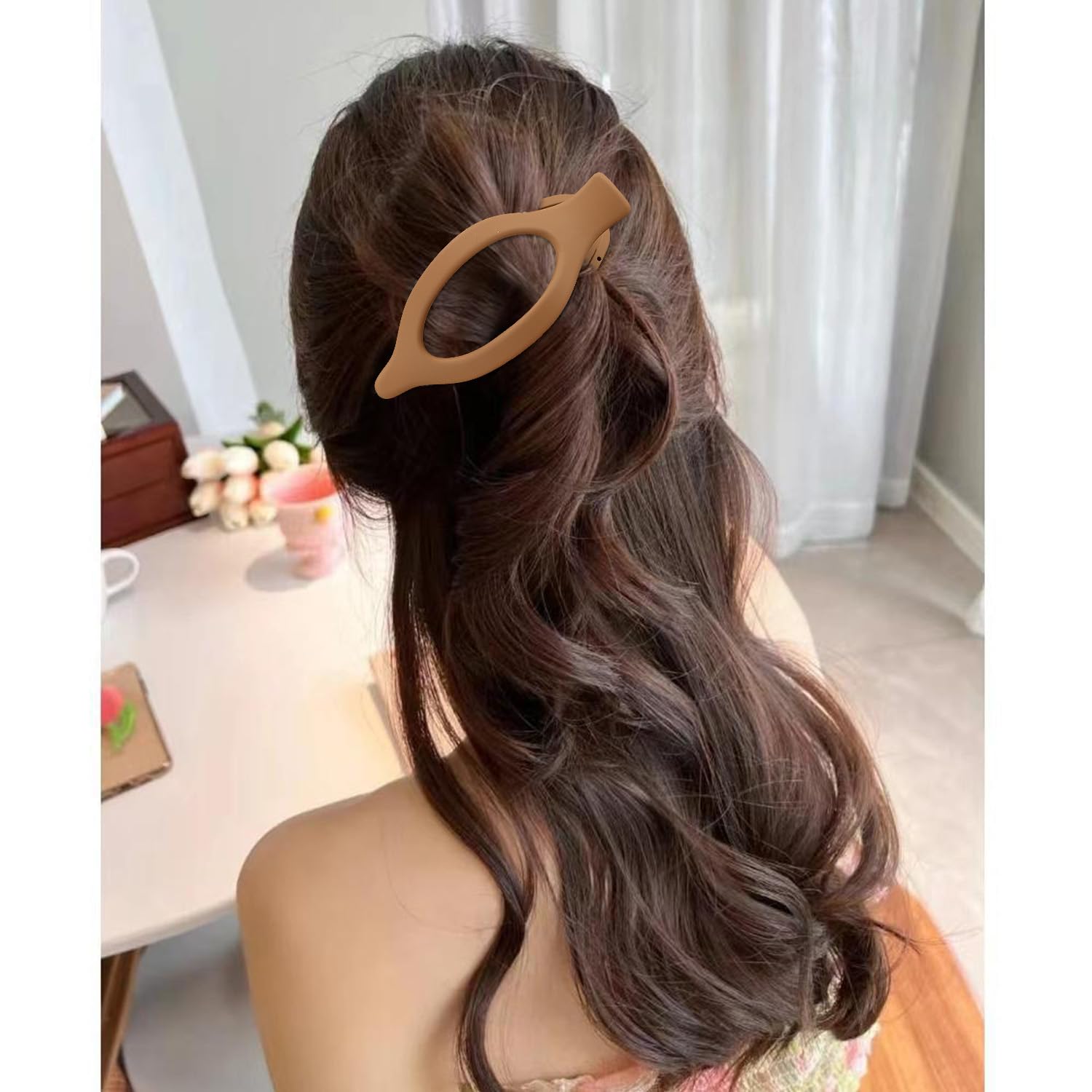 Atoden clip worn in half-up style demonstrating discreet hold and neat look