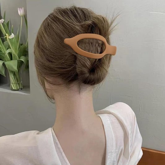 Atoden clip side profile highlighting jaw shape and secure spring for firm hold