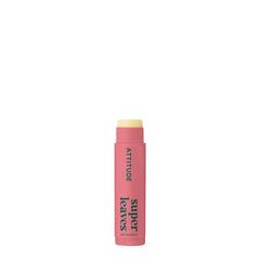 ATTITUDE applying lip balm at the beach showing everyday sun protection benefit