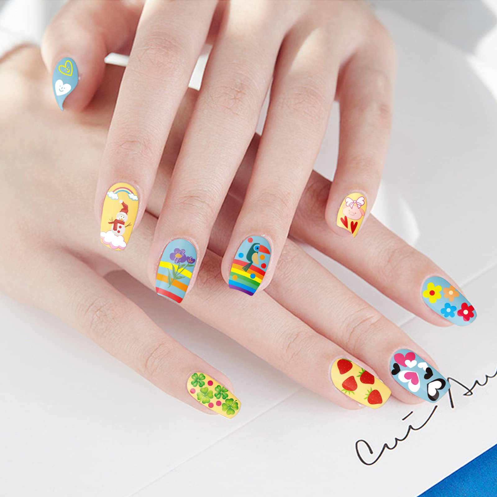atydkug stickers applied on false nails demonstrating quick salon-style finish and playful designs