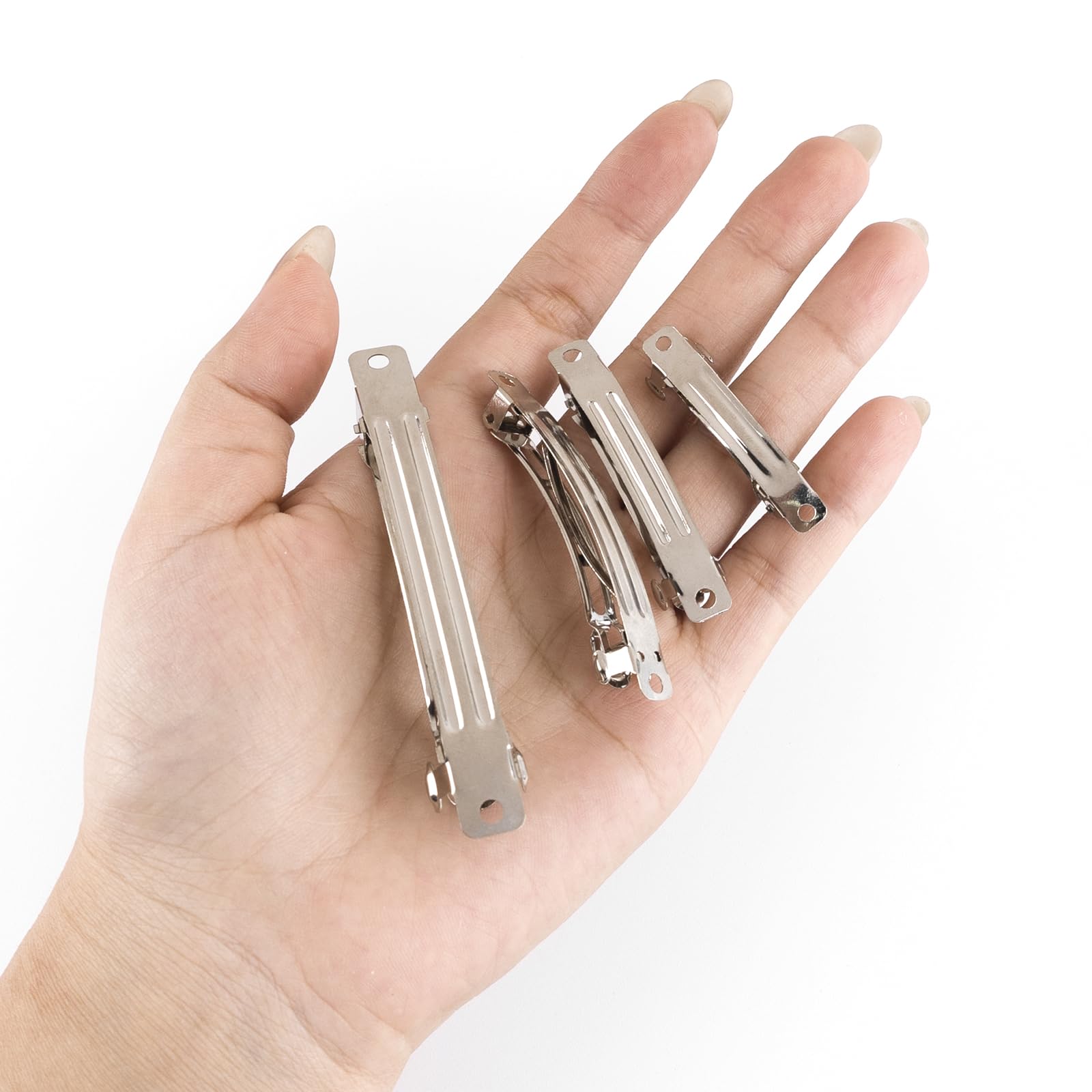AUEAR clip beside a coin to show scale, aiding accurate size selection