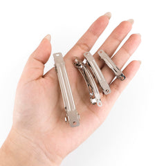 AUEAR clip beside a coin to show scale, aiding accurate size selection