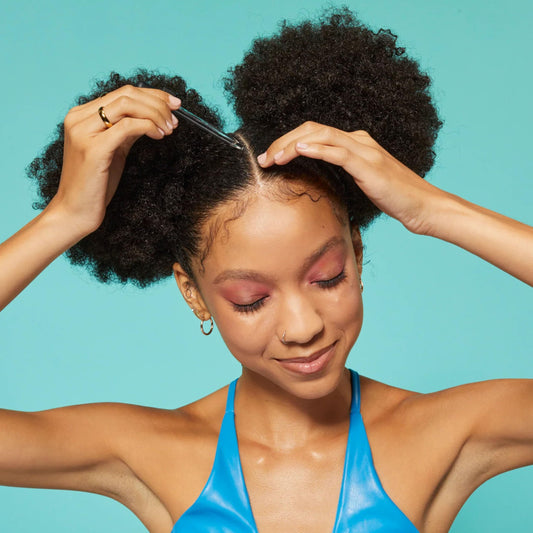 Aunt Jackie's oil texture close-up highlighting smooth absorption benefit
