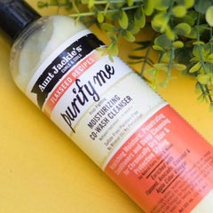 Aunt Jackie's in-hand application demonstrating easy detangling benefits