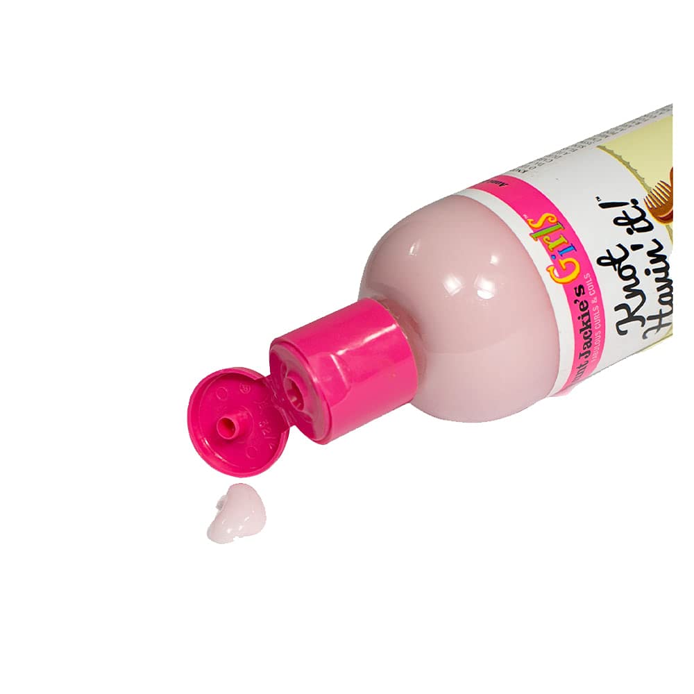 Aunt Jackie's spray being applied to damp hair demonstrating easier detangling and softness