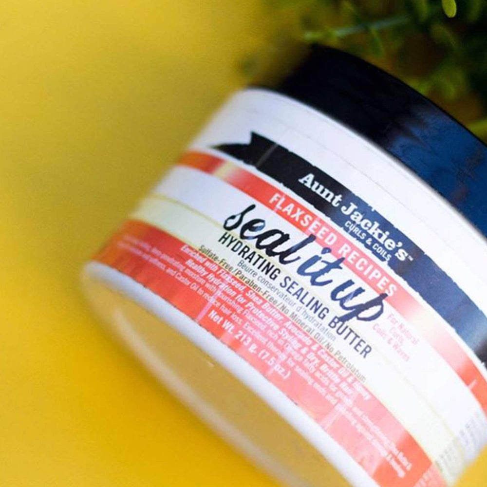 Aunt Jackie's butter being applied to hair ends, improves moisture