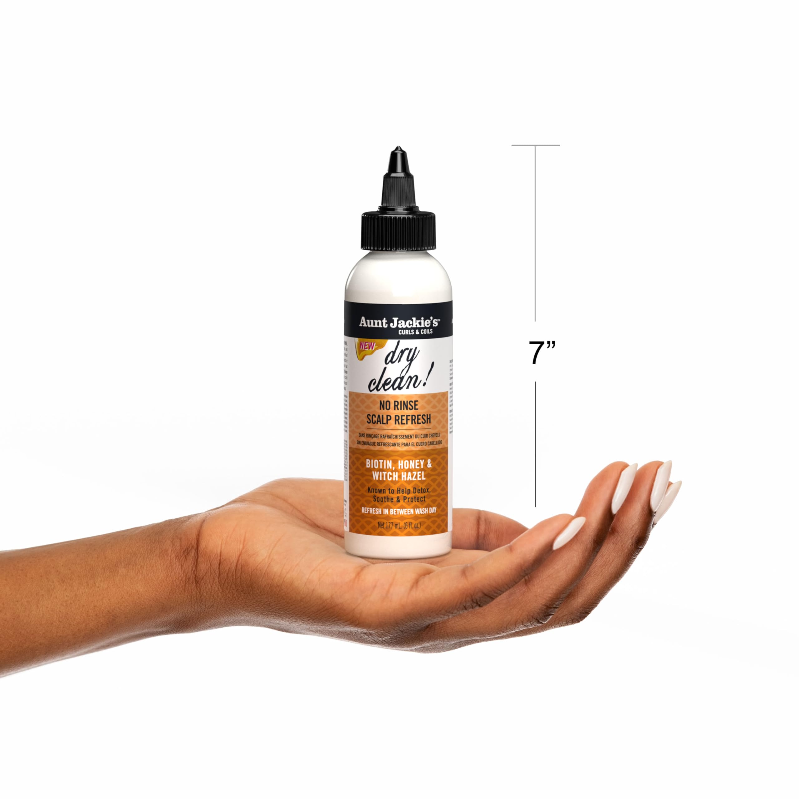 Aunt Jackie's 6 oz bottle next to hand for scale and travel-friendly benefit