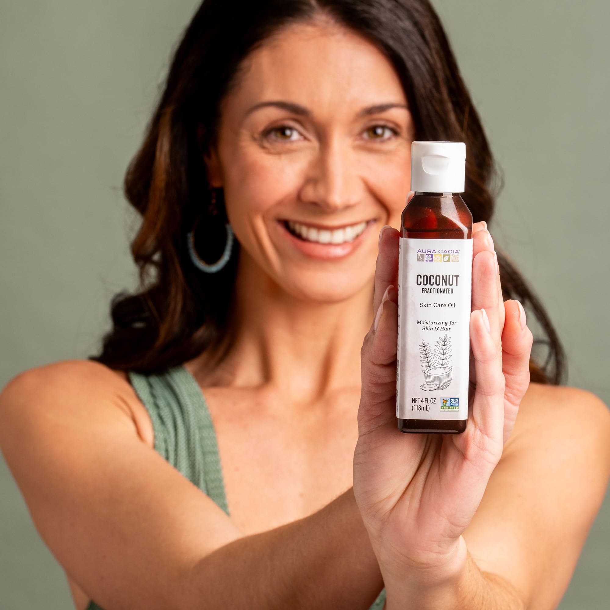 Aura Cacia bottle beside essential oils showing compatibility and blending benefit