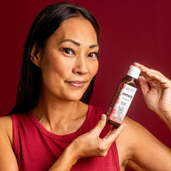 aura cacia grapeseed oil on bathroom vanity with towel, practical daily skincare routine benefit