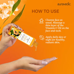Auravedic bottle held in hand for scale showing 100ml size and travel-friendly benefit