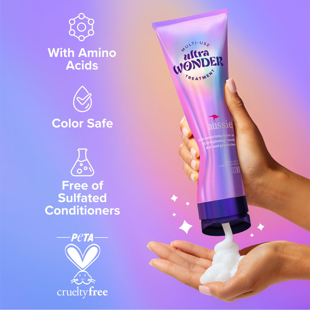 Aussie leave-in application on damp ends, showcasing smoothing and frizz control