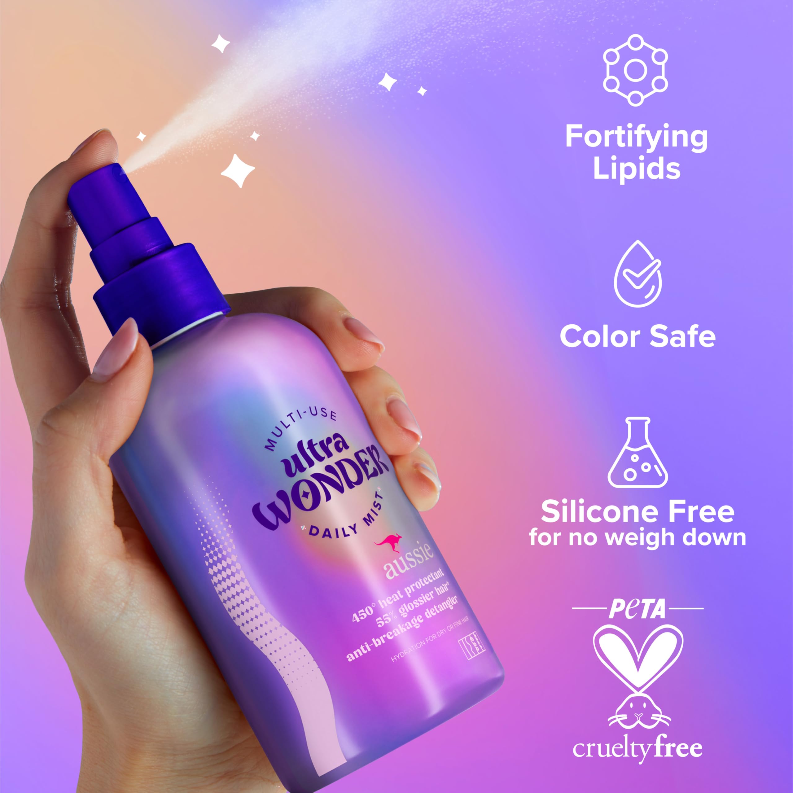 Aussie Ultra Wonder being sprayed on damp hair to detangle and protect
