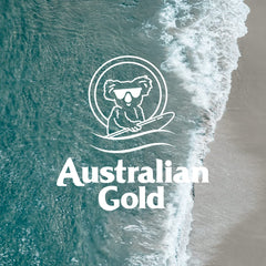 Australian Gold bottle on beach towel conveying water-resistant sun protection