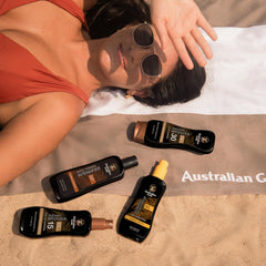 Australian Gold applied on beach scene showing water resistance and active use