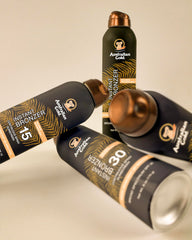 Australian Gold being sprayed on shoulder showing full-coverage application benefit