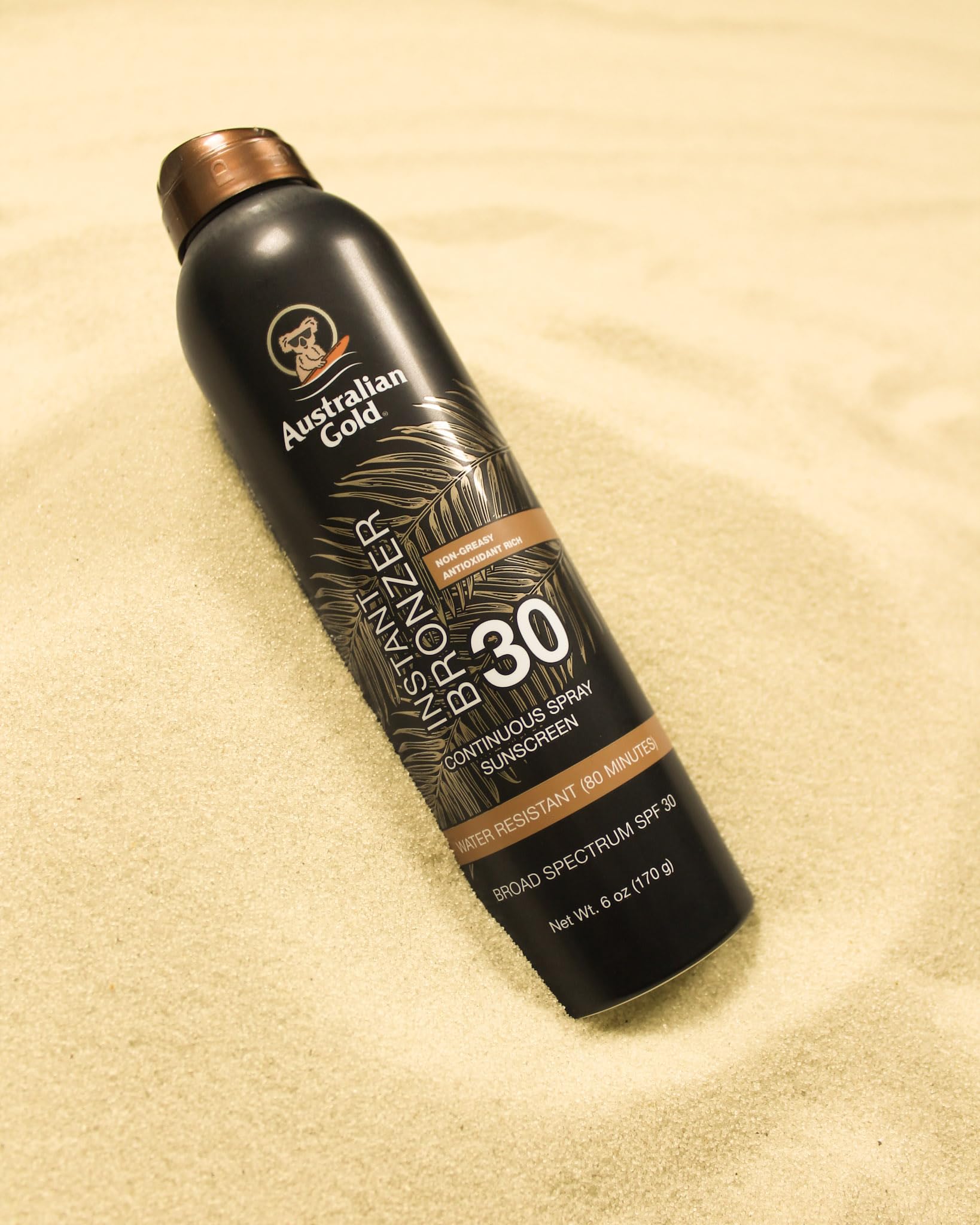 Australian Gold sunscreen texture on skin showing quick-dry glow benefit