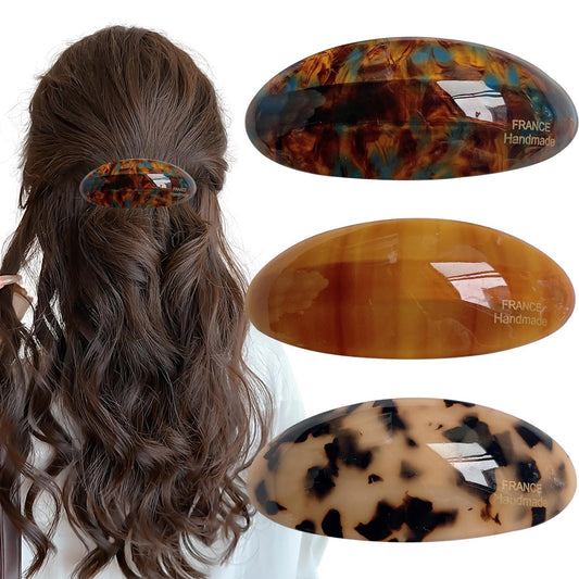 Auswalar front view of three acetate barrettes showing tortoise pattern and glossy finish for fashionable hold