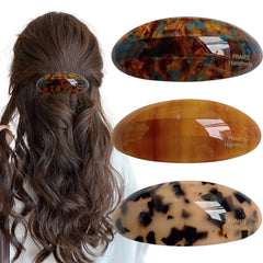 Auswalar front view of three acetate barrettes showing tortoise pattern and glossy finish for fashionable hold