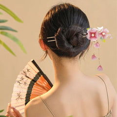 Auswalar hairpin in a bun lifestyle shot adding vintage charm and styling inspiration