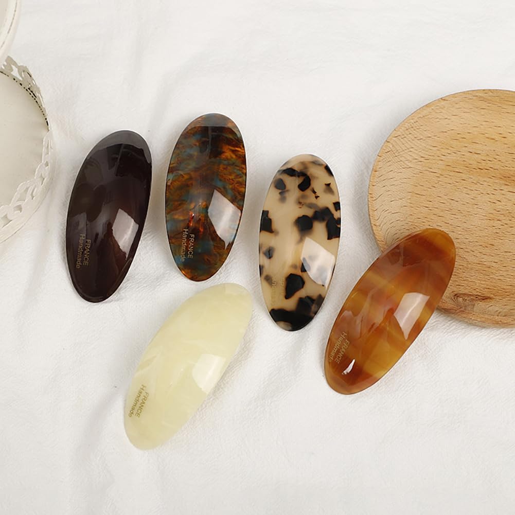 Auswalar barrettes arranged on a tabletop as a gift-ready styling set for versatile looks