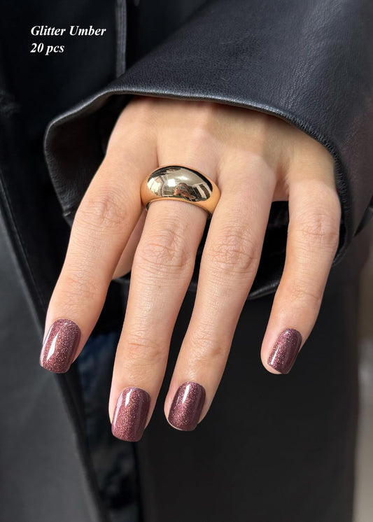 AutyaMee close-up of glitter umber strip texture demonstrating rich shimmer finish