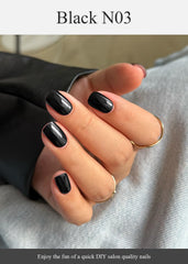 AutyaMee finished black N03 nails on hands showing salon-quality glossy look